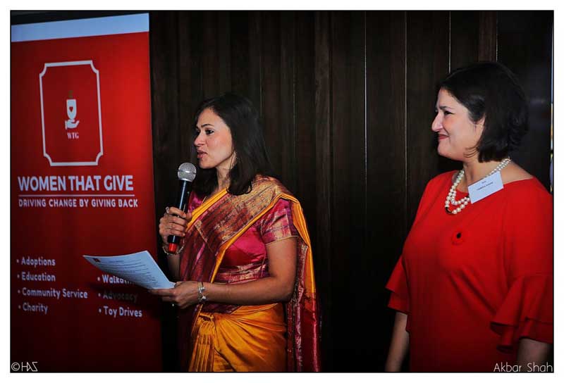 Wife of Indian consul general Dinesh Bhatia speaking at an event by Women That Give