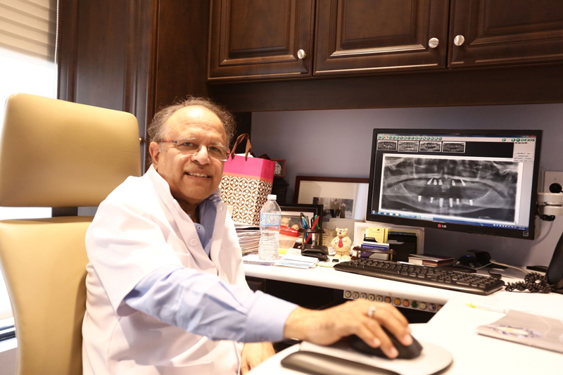 Dr Terry Papneja in dentistry office