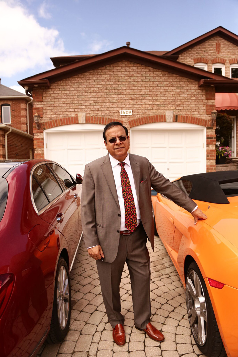 Kuldeep Sharma in front of his house.