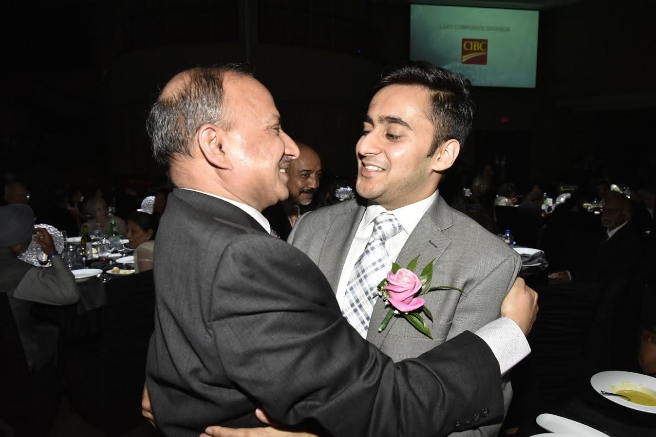 Abhishek Jain gets a hug from his father D.P. Jain on winning the ICCC award.