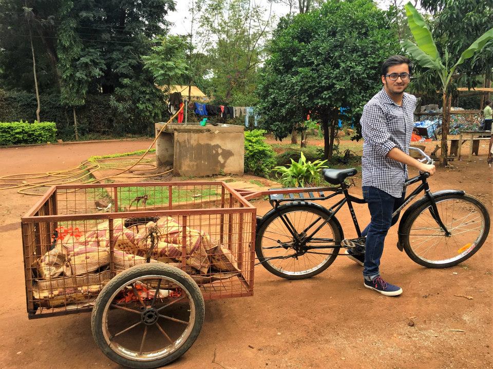 Abhishek driving the plastic pick-up bicycle in Tanzania during their plastic waste management project in the African country.