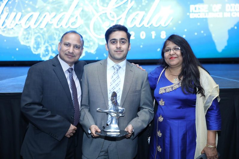 Abhishek Jain poses with his parents after winning the ICCC award.