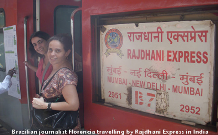 Florencia Costa and her friend Maria boarding the Rajdhani Express in India.
