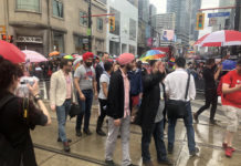 Navdeep Bains walks in Toronto Pride parade