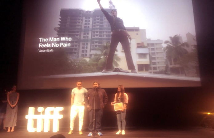 Vasan Bala and Radhika Madan accepting TIFF award